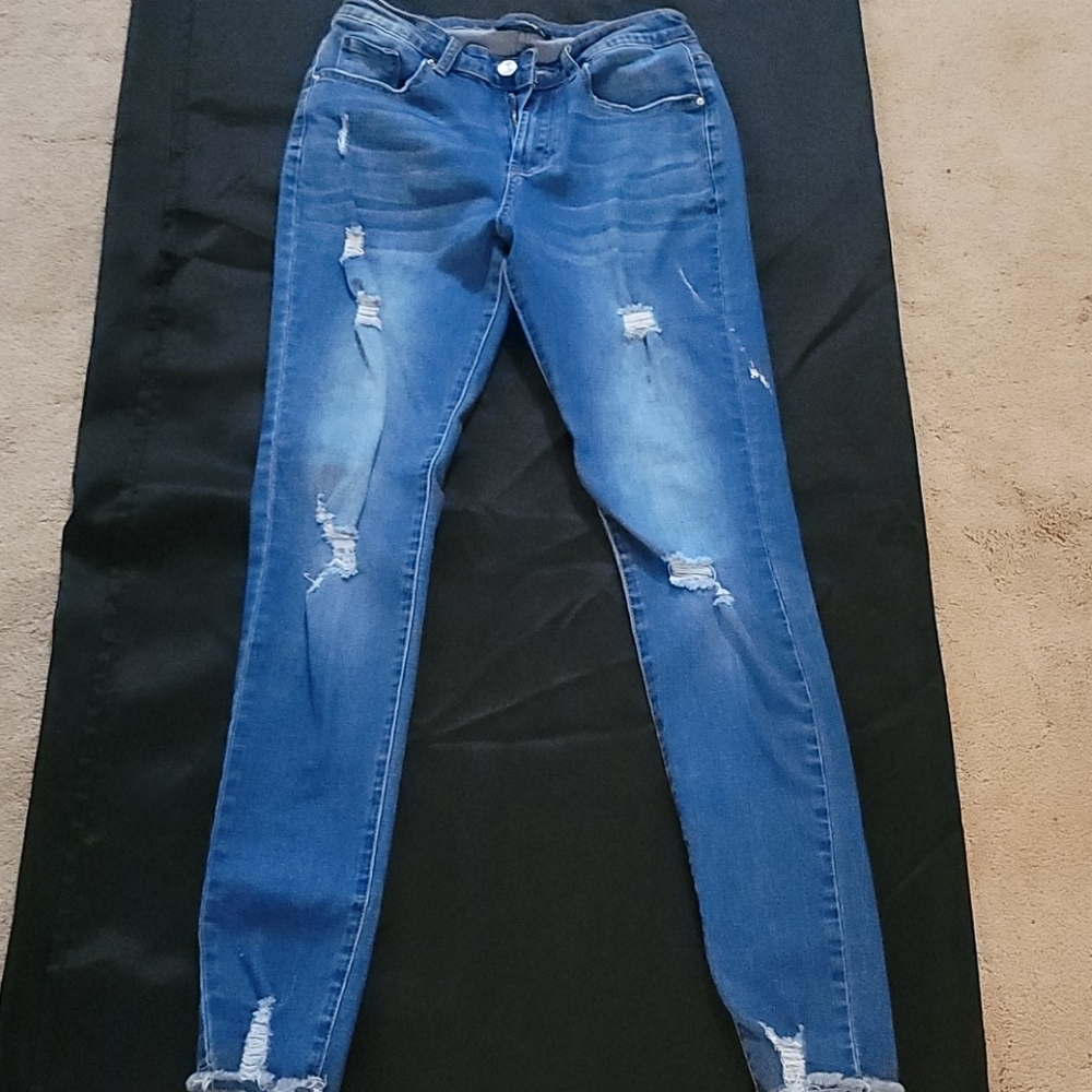 Distressed denim jeans